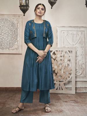 For A Stylish Look, Grab This Designer Readymade Suit In Cobalt Blue Color Which Comes Withy A jacket Instead Of Dupatta. Its Top And Jacket Are Fabricated On Muslin Paired With Satin Fabricated Bottom. Buy This Lovely Suit Now.
