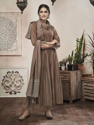 Enhance Your Personality Wearing This Designer Readymade Suit In Brown. Its Top And Dupatta Are Muslin Based Paired With Satin Fabricated Bottom. Its Elegant color And Rich Fabric Will Definitely Earn You Lots Of Compliments From Onlookers. 