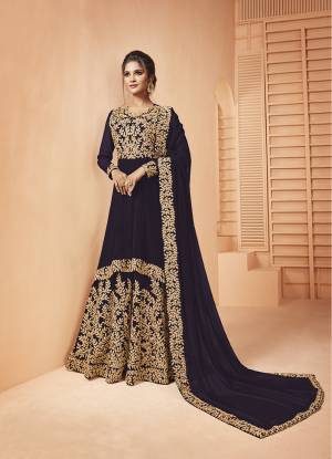 Add This Lovely Designer Floor Length Suit To Your Wardrobe In Dark Purple Color. Its Heavy Embroidered Top and Dupatta Are Fabricated on Georgette Paired With Santoon Fabricated Bottom. It Is Beautified With Detailed Coding Embroidery Giving You An Attractive Look. 