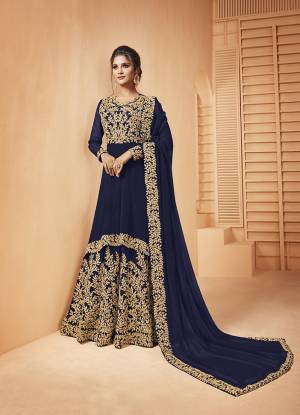 Add This Lovely Designer Floor Length Suit To Your Wardrobe In Royal Blue Color. Its Heavy Embroidered Top and Dupatta Are Fabricated on Georgette Paired With Santoon Fabricated Bottom. It Is Beautified With Detailed Coding Embroidery Giving You An Attractive Look. 