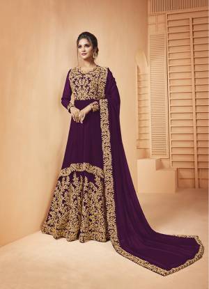 Add This Lovely Designer Floor Length Suit To Your Wardrobe In Wine Color. Its Heavy Embroidered Top and Dupatta Are Fabricated on Georgette Paired With Santoon Fabricated Bottom. It Is Beautified With Detailed Coding Embroidery Giving You An Attractive Look. 