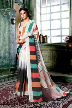 Flaunt Your Rich And Elegant Taste Wearing This Pretty Digital Printed Saree In Off-White And Multi Color Paired With Black Colored Blouse. This Saree And Blouse Are Fabricated On Linen Cotton Which Gives A Rich Look To Your Personality. 