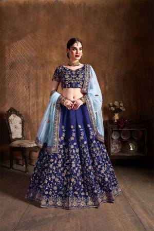 Go With The Lovely Shades Of Blue Wearing This Heavy Designer Lehenga Choli In Royal Blue Color Paired With Baby Blue Colored Dupatta. This Heavy Embroidered Lehenga Choli Is Fabricated On Art Silk Paired With Net Fabricated Dupatta. Buy This Lovely Piece Now. 