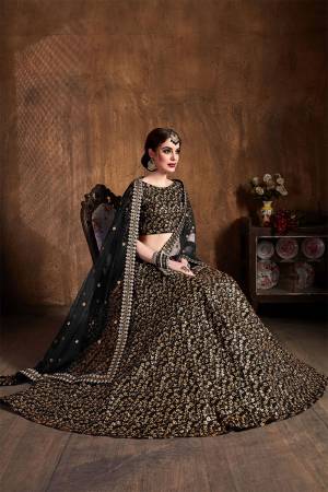 This Wedding Season Be The Most Attractive of All Wearing This Heavy Designer Lehenga Choli In All Over Black Color. This Heavy All Over Embroidered Lehenga Choli Is Fabricated On Art Silk Paired With Net Fabricated Dupatta. Its Detailed Embroidery Will Give An Attractive Look To Your Personality. 