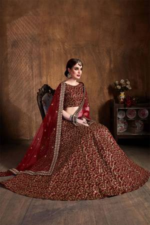 This Wedding Season Be The Most Attractive of All Wearing This Heavy Designer Lehenga Choli In All Over Maroon Color. This Heavy All Over Embroidered Lehenga Choli Is Fabricated On Art Silk Paired With Net Fabricated Dupatta. Its Detailed Embroidery Will Give An Attractive Look To Your Personality. 