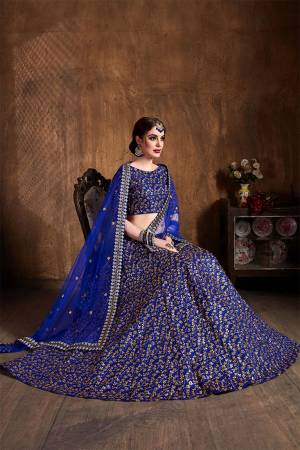 This Wedding Season Be The Most Attractive of All Wearing This Heavy Designer Lehenga Choli In All Over Royal Blue Color. This Heavy All Over Embroidered Lehenga Choli Is Fabricated On Art Silk Paired With Net Fabricated Dupatta. Its Detailed Embroidery Will Give An Attractive Look To Your Personality. 
