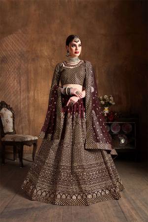 You Will Definitely Earn Lots Of Compliments Wearing This Heavy Designer Lehenga Choli In Brown Color. This Pretty Designer Embroidered Lehenga Choli Is Fabricated On Art Silk Paired With Net Fabricated Dupatta. Buy This Lehenga Choli Now.