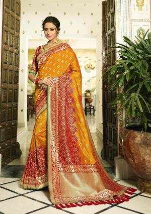 Celebrate This Festive Season In A Lovely Traditional Look With This Heavy Designer Saree In Orange And Red Color Paired With Red Colored Blouse. This Saree Is Fabricated on Banarasi Art Silk Beautified With Heavy Weave Paired with Art Silk Fabricated Blouse Beautified With heavy Embroidery.