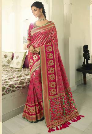 For A Proper Traditional Look, Grab This Designer Saree In Dark Pink Color Paired With Dark Pink colored Blouse. This Heavy Weaved Saree Is Banarasi Art Silk Based Paired With Art Silk Fabricated Heavy Embroidered Blouse. Buy This Saree Now.
