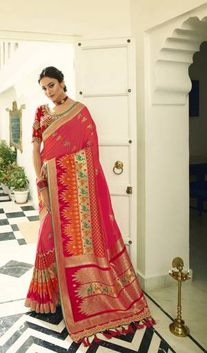 Celebrate This Festive Season In A Lovely Traditional Look With This Heavy Designer Saree In Rani Pink Color Paired With Red Colored Blouse. This Saree Is Fabricated on Banarasi Art Silk Beautified With Heavy Weave Paired with Art Silk Fabricated Blouse Beautified With heavy Embroidery.