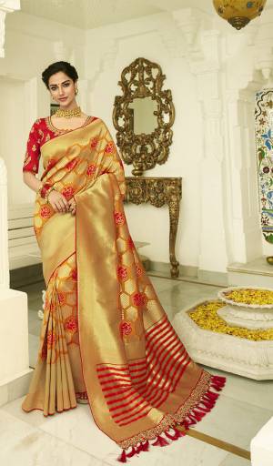 For A Proper Traditional Look, Grab This Designer Saree In Musturd Yellow And Gold Color Paired With Contrasting Red colored Blouse. This Heavy Weaved Saree Is Banarasi Art Silk Based Paired With Art Silk Fabricated Heavy Embroidered Blouse. Buy This Saree Now.