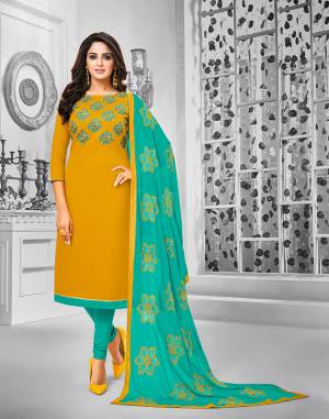 Celebrate This Festive Season With Beauty And Comfort Wearing This Suit In Musturd Yellow Colored Top Paired With Contrasting Sea Green Colored Bottom And Dupatta. This Dress Material Is Cotton Based Paired With Chiffon Fabricated Dupatta. Its Top And Dupatta are Beautified With Resham Embroidery. 