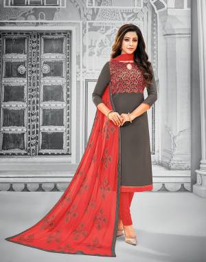 If Those Readymade Suit Does Not Lend You The Desired Comfort Than Grab This Cotton Based Embroidered Dress Material In Dark Grey Colored Top Paired With Contrasting Red Colored Bottom And Dupatta. Its Pretty Chiffon Dupatta Is Beautified With Resham Embroidery. Get This Stitched As Per Your Desired Fit And Comfort.