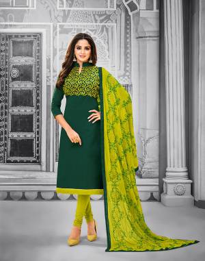 Add This Pretty Dress Material To Your Wardrobe In Pine Green Colored Top Paired With Pear Green Colored Bottom And Dupatta. This Dress Material Is Cotton Based Paired With Chiffon Fabricated Dupatta. Its Top and Dupatta are Beautified With Attractive Resham Embroidery. 