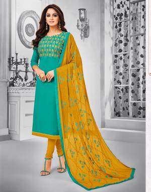 Celebrate This Festive Season With Beauty And Comfort Wearing This Suit In Sea Green Colored Top Paired With Contrasting Musturd Yellow Colored Bottom And Dupatta. This Dress Material Is Cotton Based Paired With Chiffon Fabricated Dupatta. Its Top And Dupatta are Beautified With Resham Embroidery. 