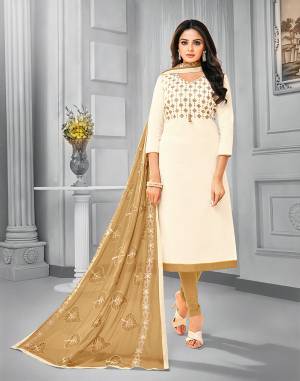Add This Pretty Dress Material To Your Wardrobe In Off-White Colored Top Paired With Beige Colored Bottom And Dupatta. This Dress Material Is Cotton Based Paired With Chiffon Fabricated Dupatta. Its Top and Dupatta are Beautified With Attractive Resham Embroidery. 