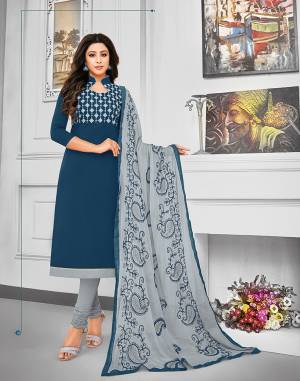 Celebrate This Festive Season With Beauty And Comfort Wearing This Suit In Navy Blue Colored Top Paired With Contrasting Grey Colored Bottom And Dupatta. This Dress Material Is Cotton Based Paired With Chiffon Fabricated Dupatta. Its Top And Dupatta are Beautified With Resham Embroidery. 