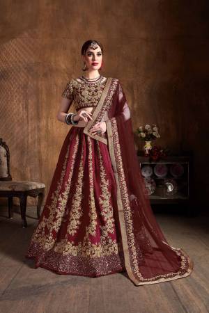 This Wedding Season Be The Most Attractive of All Wearing This Heavy Designer Lehenga Choli In All Over Maroon Color. This Heavy All Over Embroidered Lehenga Choli Is Fabricated On Art Silk Paired With Net Fabricated Dupatta. Its Detailed Embroidery Will Give An Attractive Look To Your Personality. 