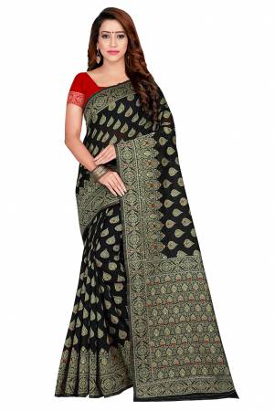 Flaunt Your Rich And Elegant Wearing This Pretty Attractive Weaved Saree. This Saree And Blouse Are Fabricated On Banarasi Art Cotton Beautified Weave All Over. It Is Light Weight and Easy To Drape.