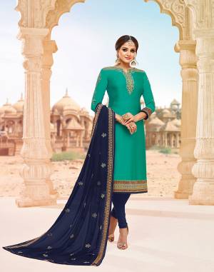 Celebrate This Festive Season Wearing This Heavy Designer Lehenga Suit In Turquoise Blue Colored Top Paired With Navy Blue Colored Bottom, Lehenga And Dupatta. Its Top Is Fabricated On Satin Georgette Paired With Santoon Bottom, Georgette Fabricated Lehenga And Dupatta. Buy This Lovely Suit With Two Bottoms To Pair As Per The Occasion. 