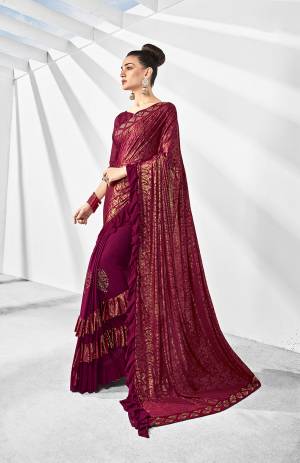Here Is A Trending Frill Pattern Designer Saree In Dark Magenta Pink Paired With Dark Magenta Pink Colored Blouse. This Saree Is Fabricated On Lycra Paired With Art Silk Fabricated Blouse. It Is Beautified With Frill And Stone Work. 