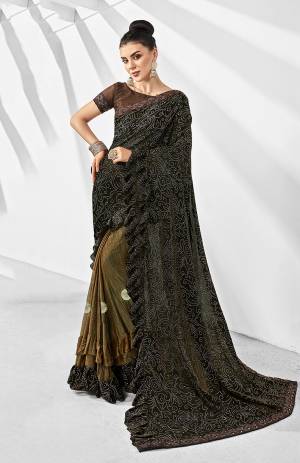 Get Ready For The Next Party At Your Place With This Designer Saree In Black & Copper Color Paired With Brown Colored Blouse. This Saree Is Lycra Based Paired With Art Silk Fabricated Blouse. Also It Is Light In Weight And Easy To Carry Throughout The Gala