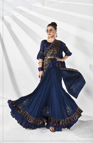 Get Ready For The Next Party At Your Place With This Designer Saree In Royal Blue And Gold Color Paired With Royal Blue Colored Blouse. This Saree Is Lycra Based Paired With Art Silk Fabricated Blouse. Also It Is Light In Weight And Easy To Carry Throughout The Gala
