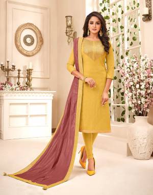 Beautiful Color Pallete Is Here With This Designer Dress Material In Yellow Color Paired With Contrasting Dusty Pink Colored Dupatta. Its Heavy Embroidered top Is Fabricated On Muslin Paired With Santoon Bottom And Chanderi Silk Fabricated Fancy Dupatta. 