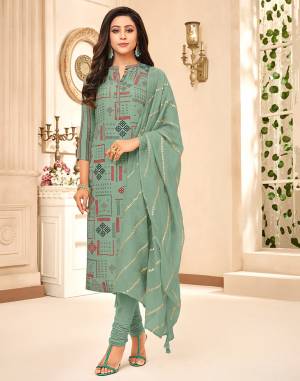 Pretty Unqiue Shade Is Here With This Designer Dress material In Dusty Green color. The Lovely Digital Printed Top IS Muslin Based Paired With Santoon Bottom And Chanderi Silk Fabricated Dupatta. Buy Now.