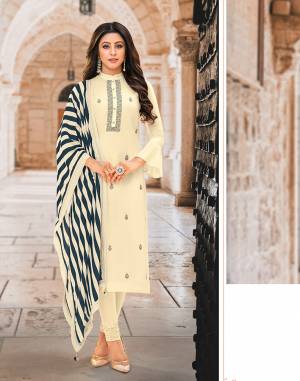 Flaunt Your Rich And Elegant Taste Wearing This Designer Straight Suit In Off-white Color Paired With Off-White And Navy Blue Colored Lining Printed Dupatta. Its Pretty Elegant Top Is Fabricated on Tussar art Silk Paired With Santoon Bottom And muslin Fabricated Dupatta. 