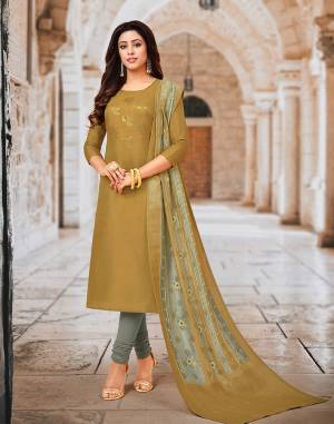 New shade Is Here To Add Into Your Wardrobe With This Designer Dress Material In Musturd Green And Grey Color Pallete. Its Embroidered Top Is Soft Silk Based Paired with Santoon bottom And Chanderi Silk Dupatta. 