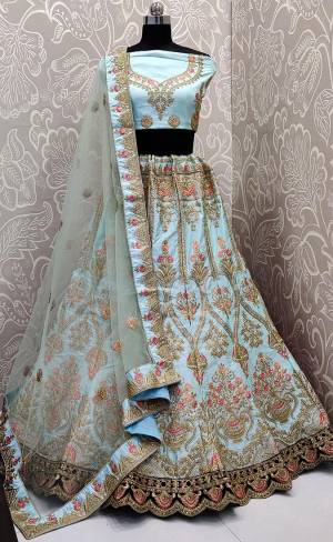 Get ready For The Upcoming Wedding Season With This Heavy Designer Lehenga Choli In Sky Blue Color. This Pretty Heavy Embroidered And Attractive Lehenga Choli Is Fabricated on Satin Silk Paired With Net Fabricated Dupatta. Its Detailed Embroidery And Color Pallete Will earn You Lots Of Compliments From Onlookers. 
