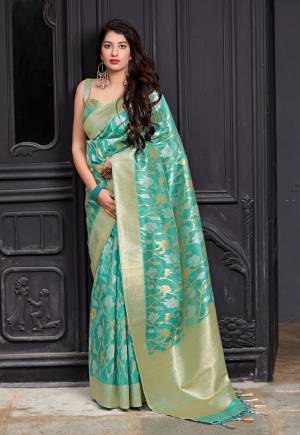 Here Is A Royal Looking Heavy Weaved Designer Saree In Sea Green Color Paired With Sea Green Colored Blouse. This Saree And Blouse Are Fabricated On Banarasi Art Silk Which Gives A Rich Look To Your Personality.