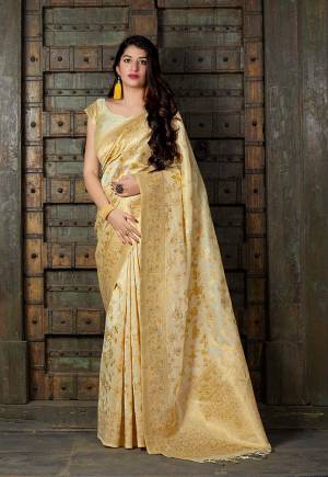 Here Is A Royal Looking Heavy Weaved Designer Saree In Cream Color Paired With Cream Colored Blouse. This Saree And Blouse Are Fabricated On Banarasi Art Silk Which Gives A Rich Look To Your Personality.