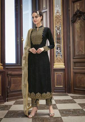 For A Bold And Beautiful Look, Grab This Heavy Designer Straight Suit In Black Color Paired With Cream Colored Dupatta. This Beautiful Top And Bottom Are Silk Based Paired With Net Fabricated Dupatta. It Is Beautified With Heavy Embroidery Over The Top, Bottom And Dupatta. 