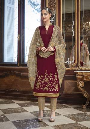 Get Ready For The Upcoming Wedding And Festive Season Wearing This Designer Straight Suit In Maroon Color Paired With Beige Colored Bottom And Dupatta. Its Top Is Fabricated On Georgette Paired With Silk Based Bottom And Net Fabricated Heavy Embroidered Dupatta. Buy Now.