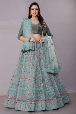 This Wedding Season, Look The Most Graceful Of All Wearing This Heavy Designer Lehenga Choli In Pastel Blue Color. Its Blouse, Lehenga And Dupatta are Fabricated on Net Beautified With Tone To Tone Coding Work And Contrasting Resham Embroidery With Stone Work. Buy Now.