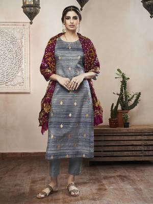 Flaunt your Rich and Elegant Taste Wearing This Designer Readymade Suit In Dark Grey Color Paired With Contrasting Wine Colored Dupatta. Its Top Is Art Silk Fabricated Paired With Satin Silk Bottom And Crush Dupatta. 
