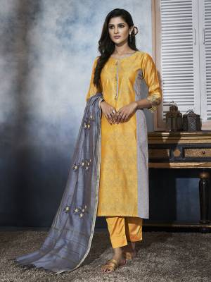 Celebrate This Festive Season In This Beautiful Readymade Designer Suit In Yellow And Grey . This Suit In Art Silk Based  Paired With Chanderi Silk Fabricated Dupatta, Which Gives A Rich Look To Your Personality. 