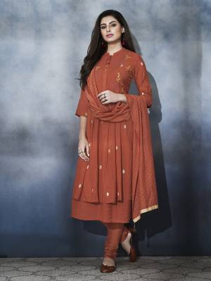 You Will Definitely Earn Lots Of Compliments Wearing This Designer Readymade A-Line Suit In Rust Orange Color. Its Beautiful Top And Dupatta Are Fabricated On Muslin Paired With Satin Bottom. All Its Fabrics are Soft Towards Skin And Ensures Superb Comfort All Day Long. 