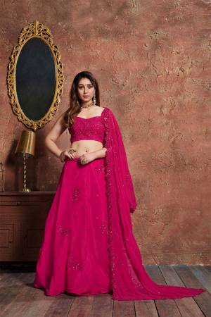 You Will Definitelty Earn Lots Of Compliments Wearing This Designer Lehenga Choli In All Over Dark Pink Color. This Lehenga Choli IS Georgette Based Beautified with Detailed Tone To Tone Embroidery Giving It A Rich And Subtle Look. 