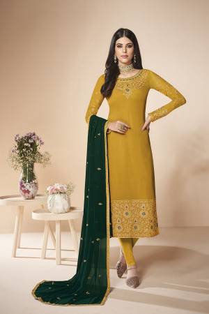 Here Is A Rich And Elegant Looking Designer Straight Suit In Musturd Yellow Color Paired With Pine Green Colored Dupatta. Its Embroidered Top And Dupatta Are Fabricated On Georgette Paired With Santoon Fabricated Bottom. Buy This Semi-Stitched Suit Now.
