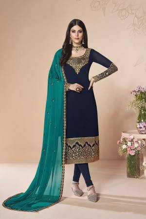 Here Is A Rich And Elegant Looking Designer Straight Suit In Navy Blue Color Paired With Blue Colored Dupatta. Its Embroidered Top And Dupatta Are Fabricated On Georgette Paired With Santoon Fabricated Bottom. Buy This Semi-Stitched Suit Now.