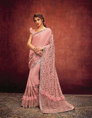 Delicate, divine and ultra feminine, this peach saree is meant to fascinate your inner fashion diva and the onlookers alike. Pair with delicate jewels to balance the look. 