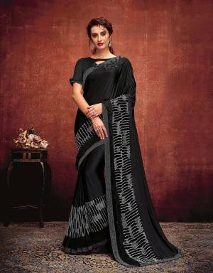It's time to ace the minimal yet outstanding saree look in this gorgeous black saree with fancy fabric details . Drape it in half-falling style for an elegant look. 