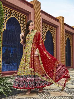 Here Is A Readymade Designer Floor Length Suit In Yellow Color Paired With Contrasting Red Colored Dupatta. Its Attractive Printed Top Is Fabricated On Soft Silk Paired With Cotton Crepe Fabricated Bottom And Sequence Worked Net Fabricated Dupatta. This Readymade suit Is Available In All Regular Sizes. Buy Now.