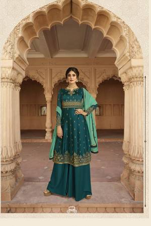 Enhance Your Personality Wearing This Designer Kali Patterned Suit In Teal Blue Color Paired with Teal Blue Colored Plazzo And Sea Green Colored Dupatta. It Pretty Embroidered Top Is Fabricated On Georgette Paired With Santoon Bottom And Georgette Fabricated Dupatta. Buy This Semi-Stitched Suit Now.