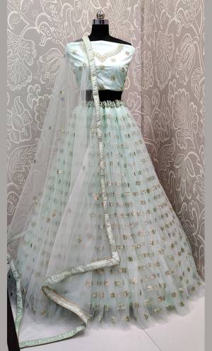 Get Ready For The Upcoming Wedding Season With This Very Beautiful Designer Lehenga Choli In All Over Baby Blue Color. This Heavy Embroidered Lehenga Choli Is Fabricated On Net Beautified With Tone To Tone Embroidery Which Gives A Subtle Look To Your Personality.