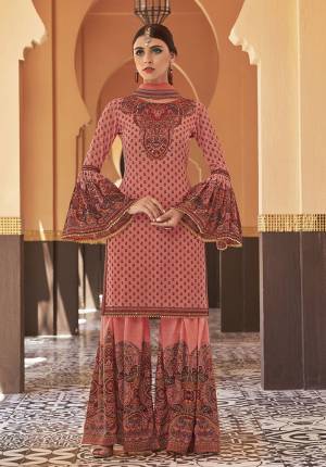 Adorn The Seasons Trend With This Trendy Designer Sharara Suit In Pink Color. Its Top Is Fabricated On Georgette Paired With Crepe Satin Bottom And Chiffon Fabricated Dupatta. This Lovely Suit Is Beautified With Detailed Attractive Prints And Stone Work. Buy This Lovely Piece Now.