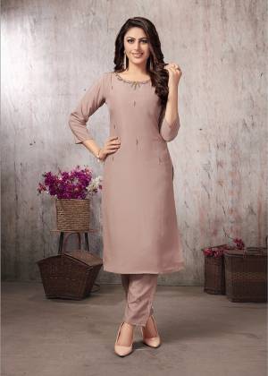 For Your Festive Wear, Grab This Designer Readymade Pair Of Kurti And Pants In Beige Pink Color. This Pretty Pair Is Muslin Fabricated Beautified With Minimal Elegant Hand Work. Its Rich Color And Fabric Will Definitely Earn You Lots Of Complimets From Onlookers. 